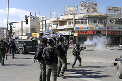 Picture for al-Ram Village - Palestine: : Occupation forces fire gas into the streets of Ar Ram in an attempt to disperse the protesters
