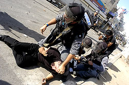 Picture for al-Ram Village - Palestine: : Occupation forces arresting Palestinian demonstrators on the streets of Ar Ram.